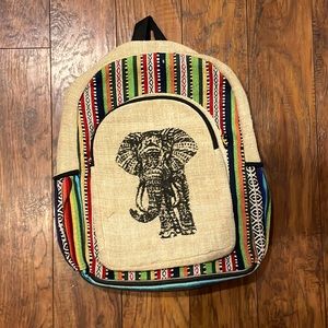 A backpack with an elephant on the front and a Line design